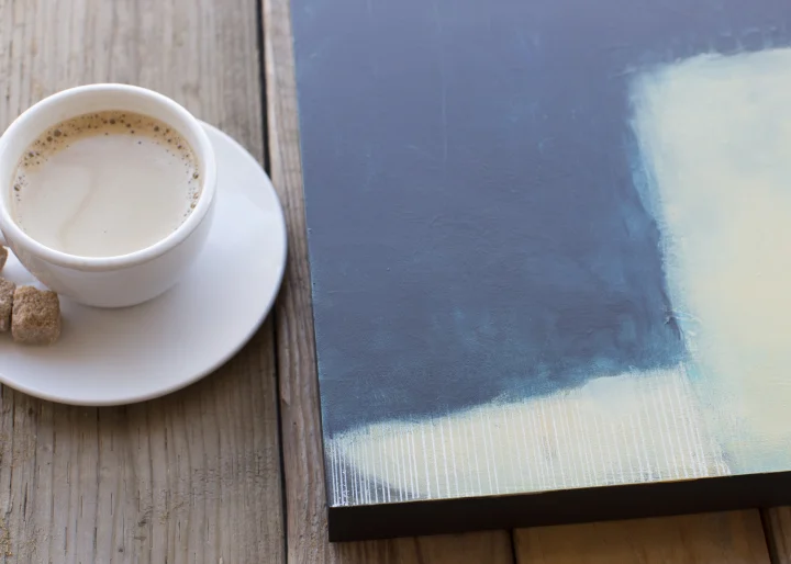 The Dog Is Laying in the Grass