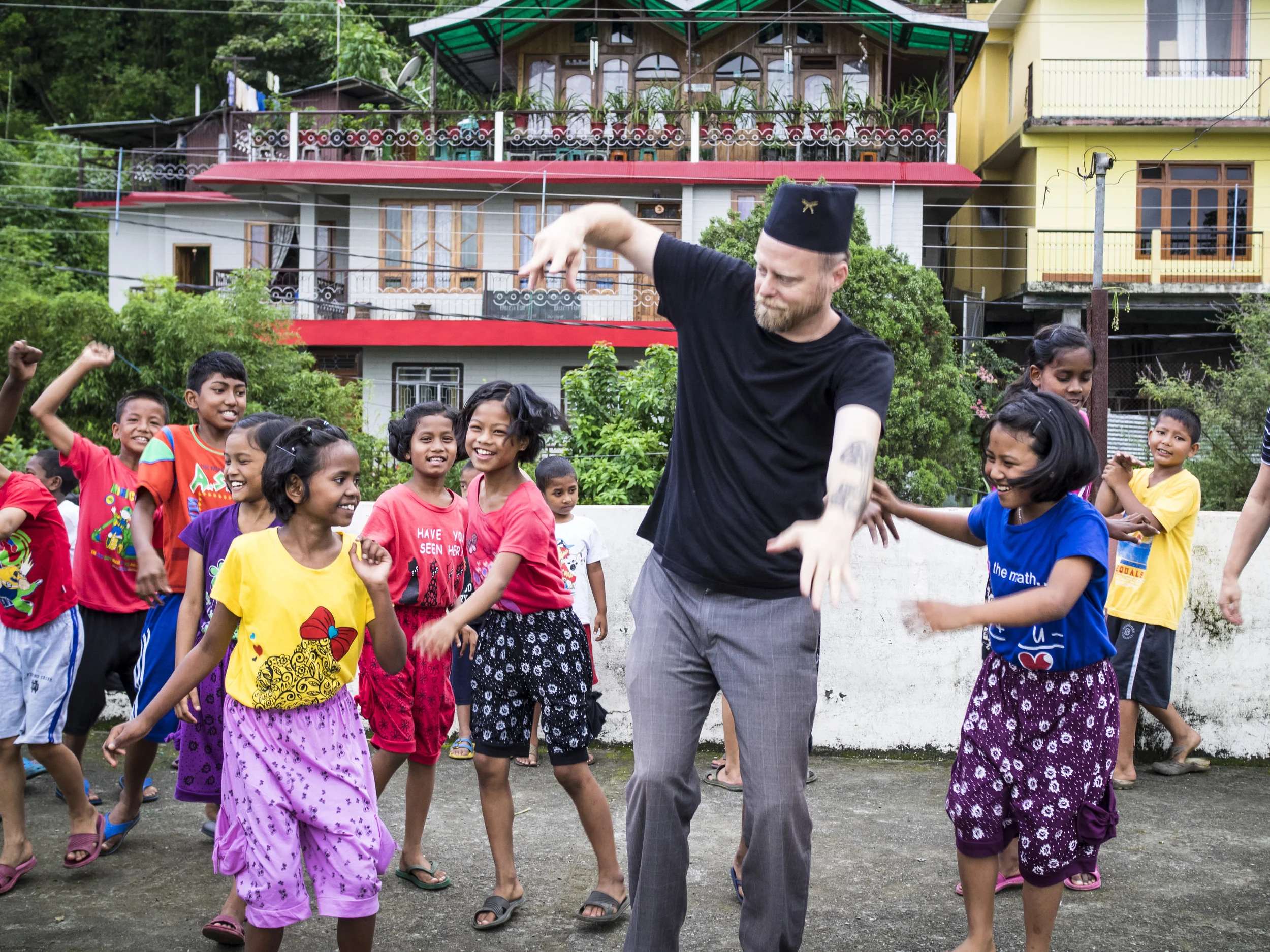 Executive Director John McCollum enjoys a dance break with the kids from our Kalimpong 2 home in India.