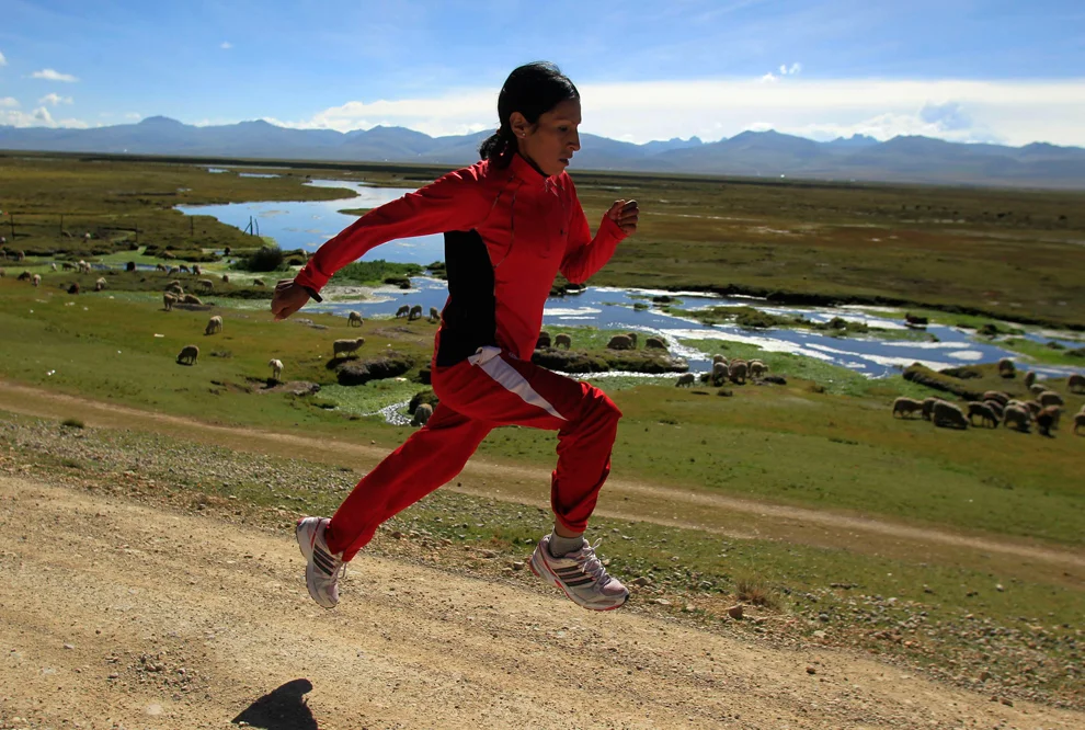 Marathon runner Gladys Tejeda, the first Peruvian athlete who qualified for the London Olympic Games, runs during her training in the Andean province of Junin on May 14. A private company will take Gladys' mother Marcelina Pucuhuaranga (69) to London as part of the "Thank you Mom" program. The program will take about 120 mothers of different athletes around the world to attend the games. Tejeda, the youngest of nine children, returned to her hometown to visit her mother and to focus on training where she will run more than 20 km every day in the highlands. (Pilar Olivares/Reuters)