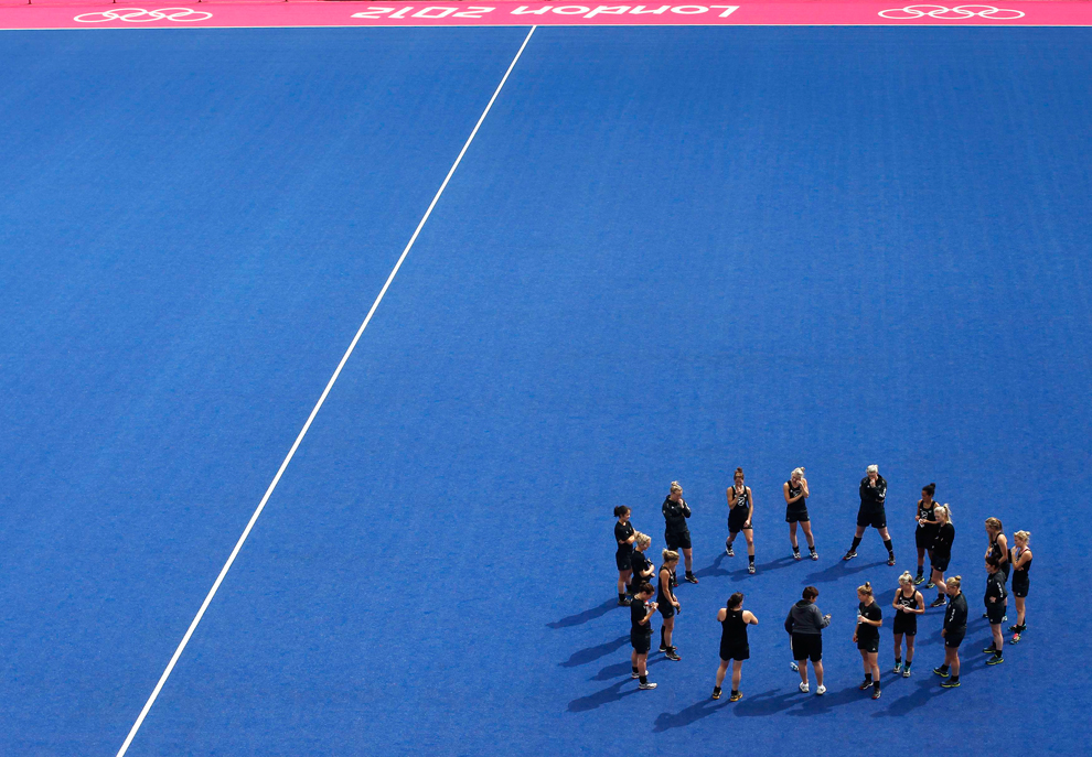  ​  The New Zealand women's hockey team stretch after a training session at the Olympic Hockey venue, the Riverbank Arena, at the Olympic Park in Stratford, east London on July 17. The 2012 Olympic Games in London start on July 27. (Andrew Winning/Re