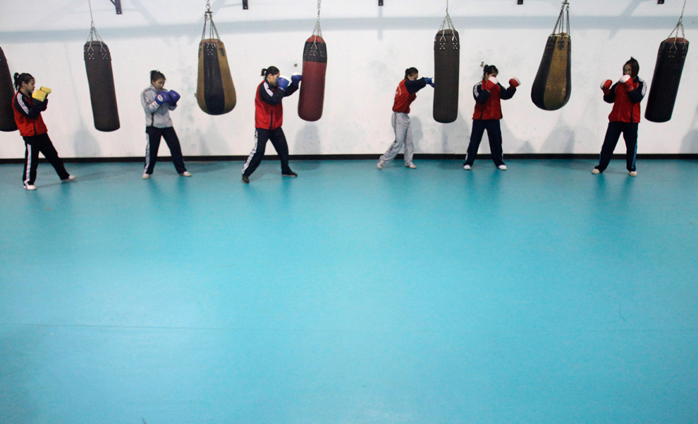  ​  Members of the Vietnam female boxing team practise at a training center in Hanoi on Feb. 17. Vietnam plans to send it's boxers to North Korea for training in preparation for the London Olympics. (Kham/Reuters) 