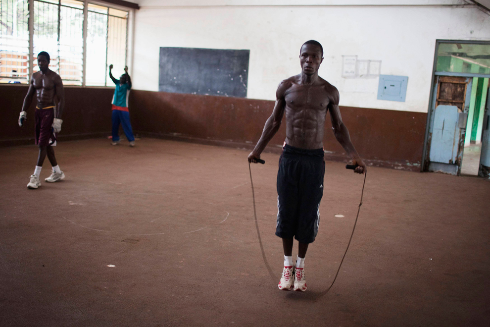  ​  Olympic hopeful Abdul Rashid Bangura (27) jumps rope while training at the national stadium in Sierra Leone's capital of Freetown on April 25. Sierra Leone's national boxing team was scrambling to raise money to send athletes to an Olympic qualif