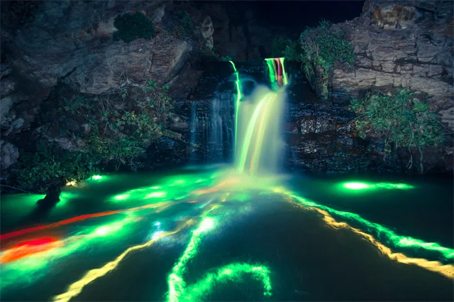 Glowstick Trails in Night Waterfalls