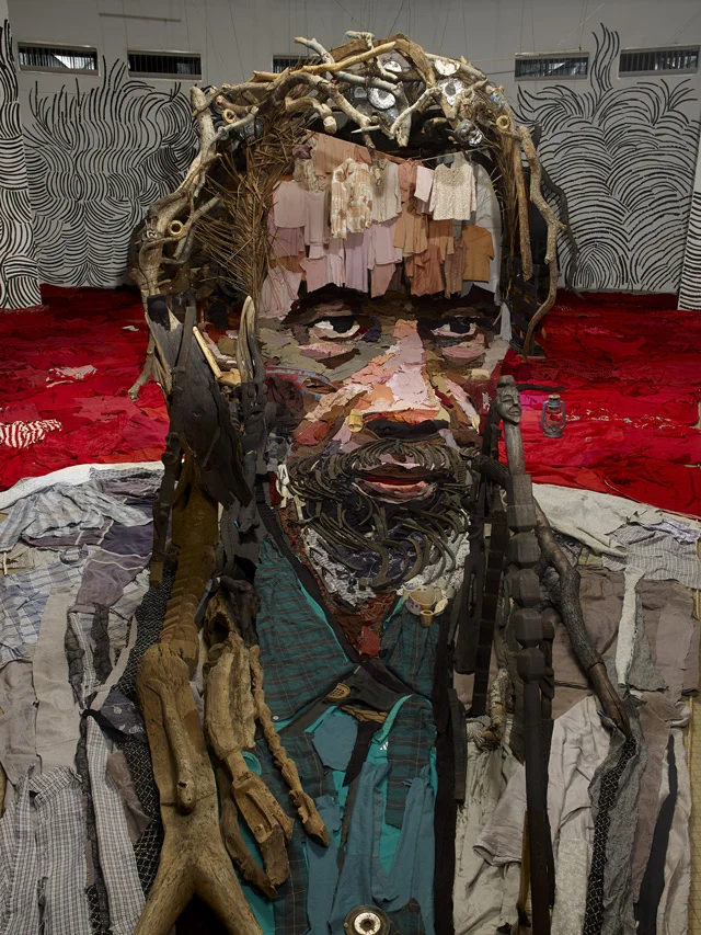 A Room of Stuff Arranged to Create this Anamorphic Portrait