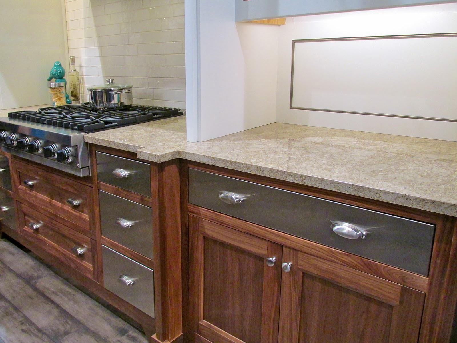 Smooth stainless drawers accentuate the wood grain. What a way to mix rustic and modern!