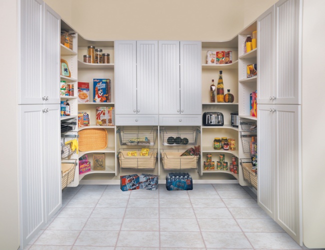 Talbot Door | White Melamine. This generous pantry offers open storage for quick access to frequently used items and plenty of closed storage for everything else! The wire baskets are especially useful for cleaning supplies, snack bags, and other odd-sized items that don’t stack well on shelves. All of the shelves in this 3-wall design are fully adjustable for maximum efficiency. The curved design of the corner modules keeps items from getting lost behind other products in deep, dark corners.