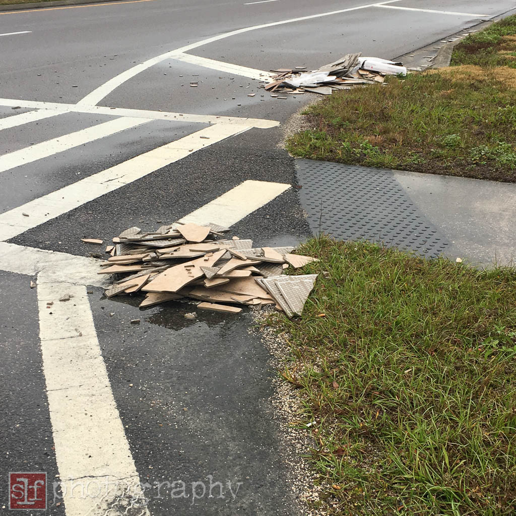 Ceramic tiles fell off of a truck making a turn. Another downside to growth.