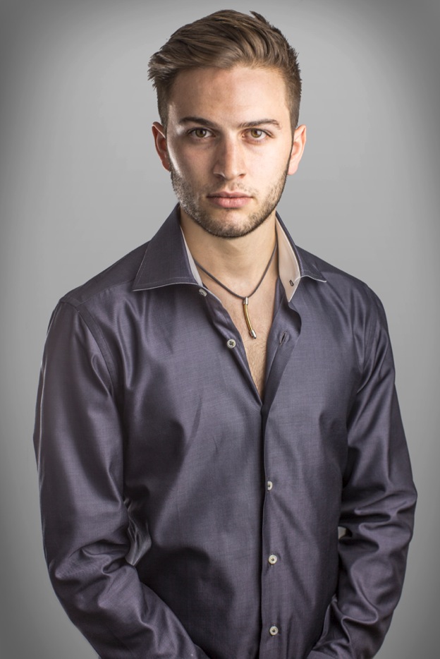 Studio portrait. Shot with two lights and a white paper background.