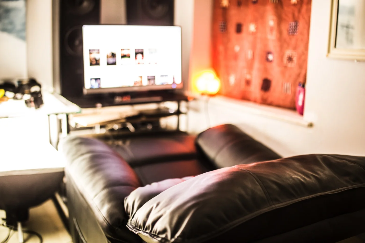 Here it is reclined. It is really lovely for watching Netflix and having a nap. I had to move one my my desk's legs to allow the recliner's footrest to go right under the desk. 