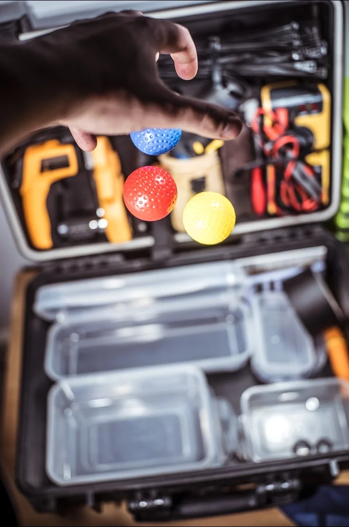 Me dropping some balls into my half-made tool box. Click for larger.