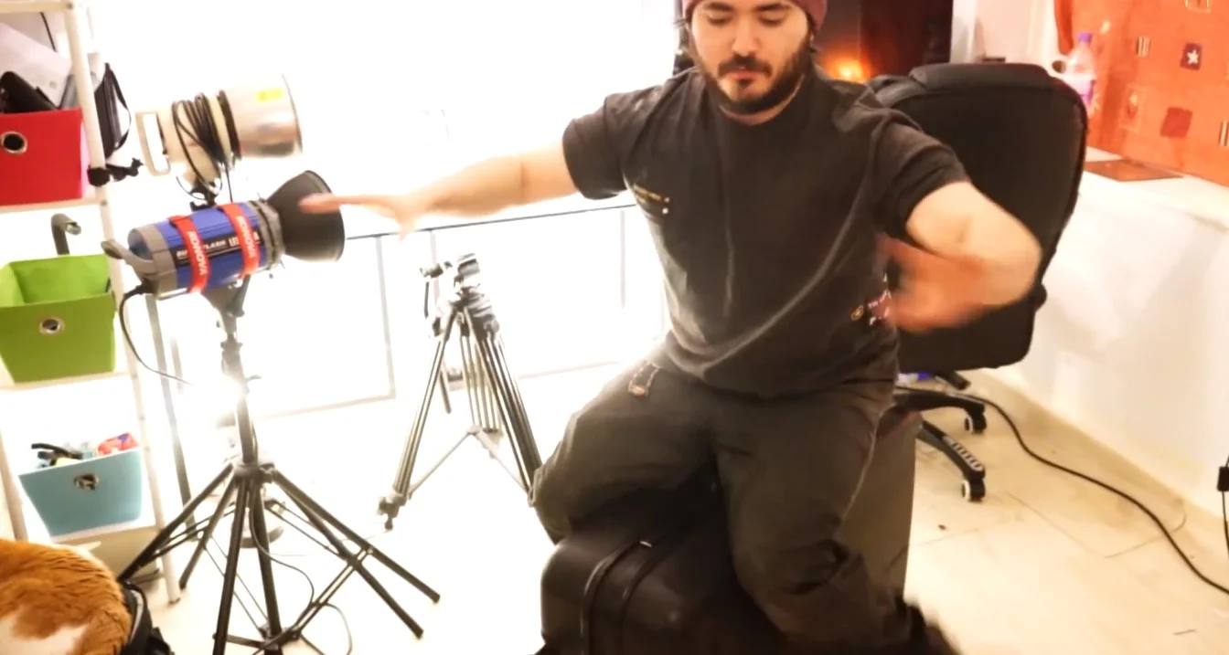 Me sitting on my older Samsonite in my review video