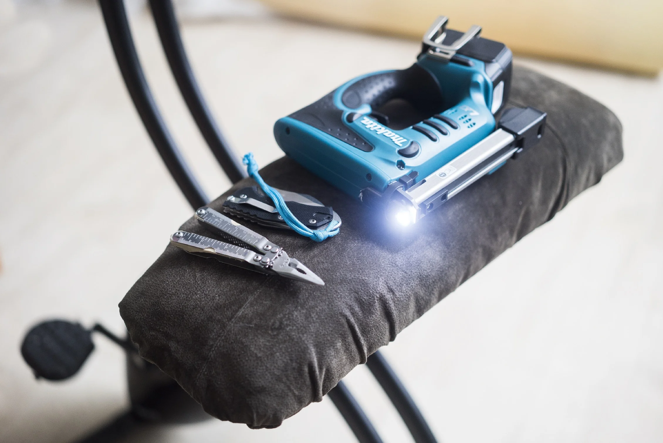 A seat I made for my exercise bike, using scrap wood, scrap pieces of foam, suede from an old jacket and about 300 staples. I used the Makita stapler, a Lansky World Legal knife and a SOG S44 Pocket PowerPlier.