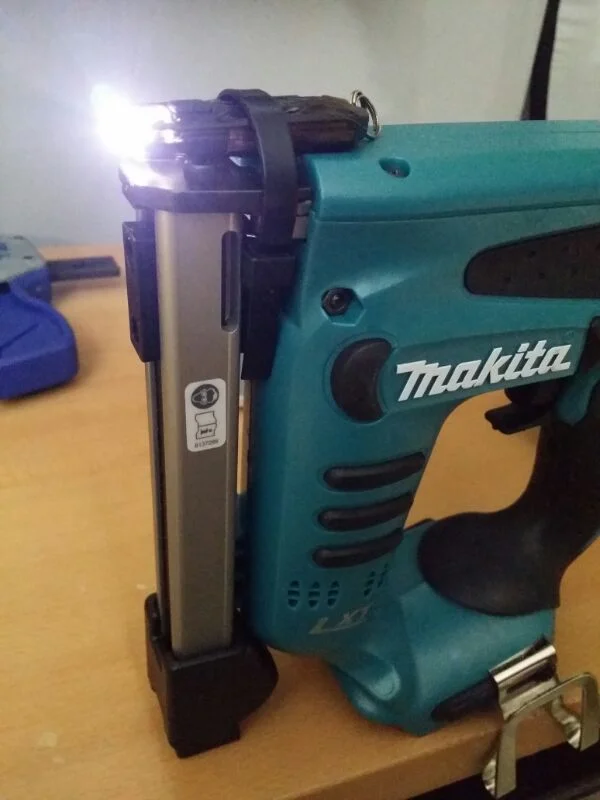 I added an LED light using a NiteCore rechargeable torch and a releasable zip tie.