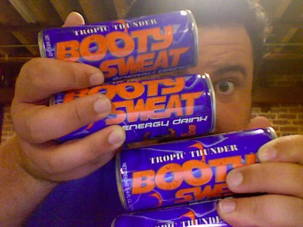 Ryan Davis holding up the Booty Sweat I sent to the Whiskey Media office.