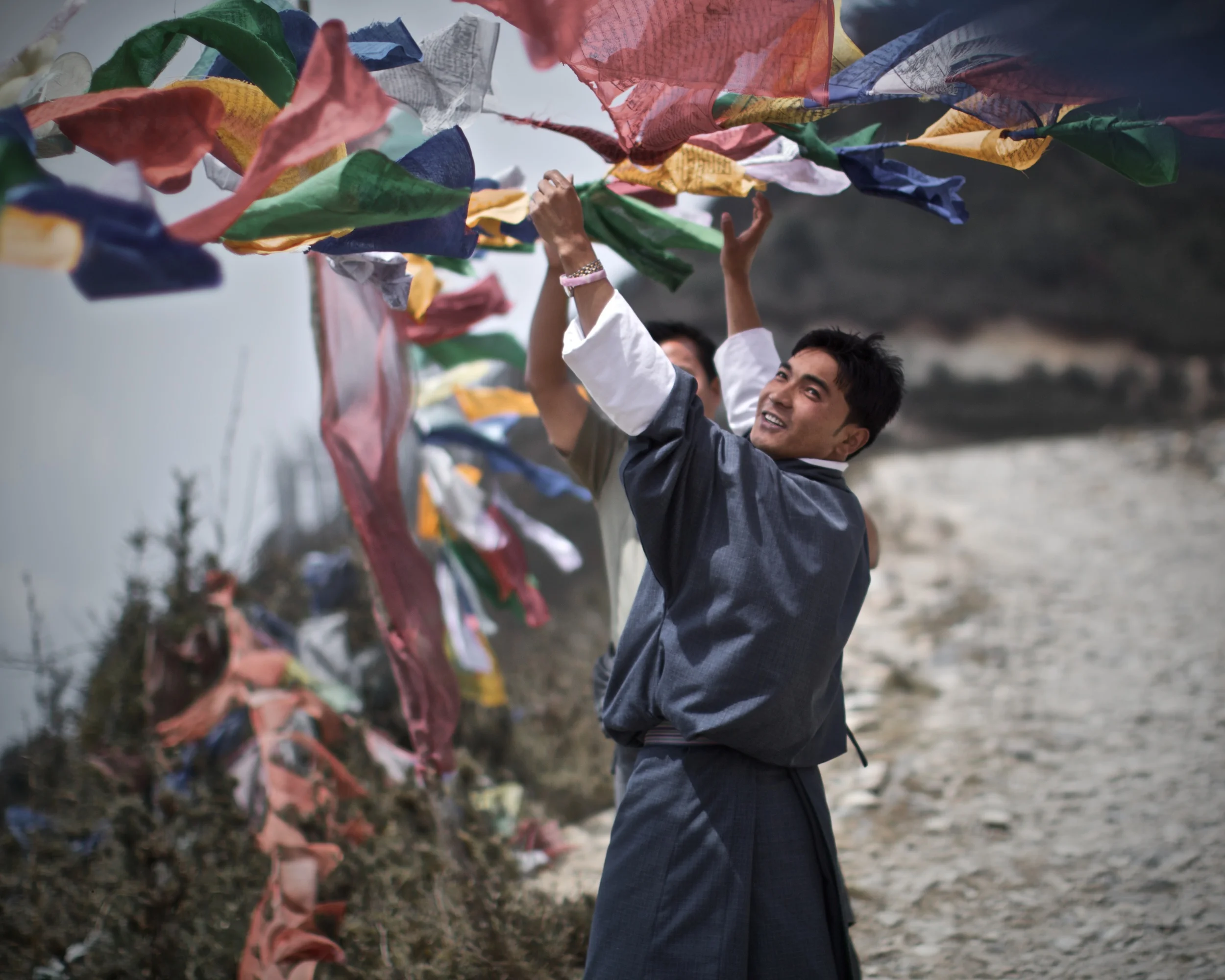 Hanging prayer flags in a windy place.jpg