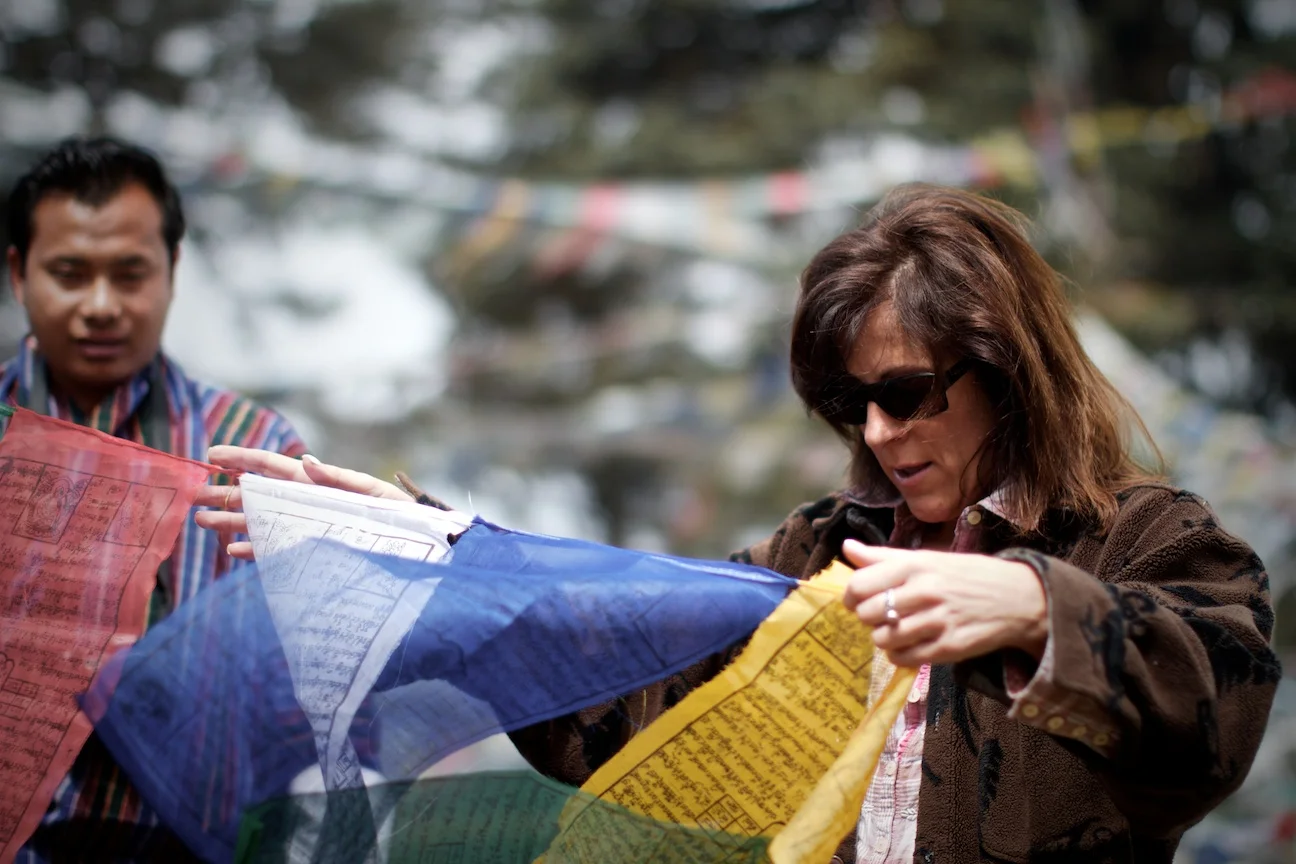 Patty hanging her prayer flags.