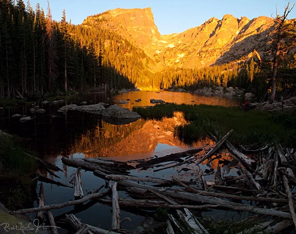 6:38 AM: Dream Lake as the rising sun strikes the mountain backdrop.