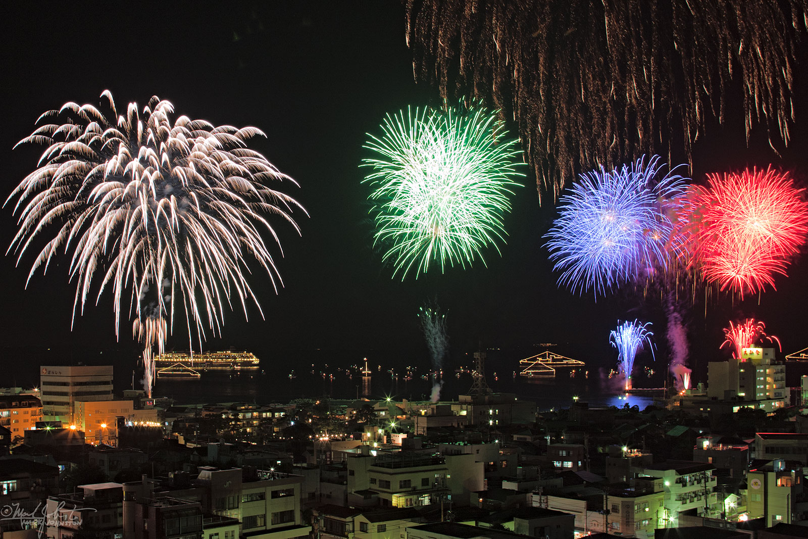 Fireworks along the waterfront, Ito, Japan.