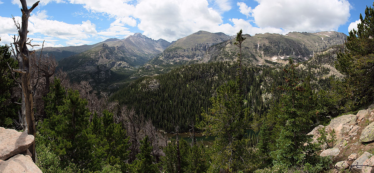Long's Peak and Glacier Gorge in the distance, and a glimpse of Dream Lake below, from the Flattop Mountain Trail.