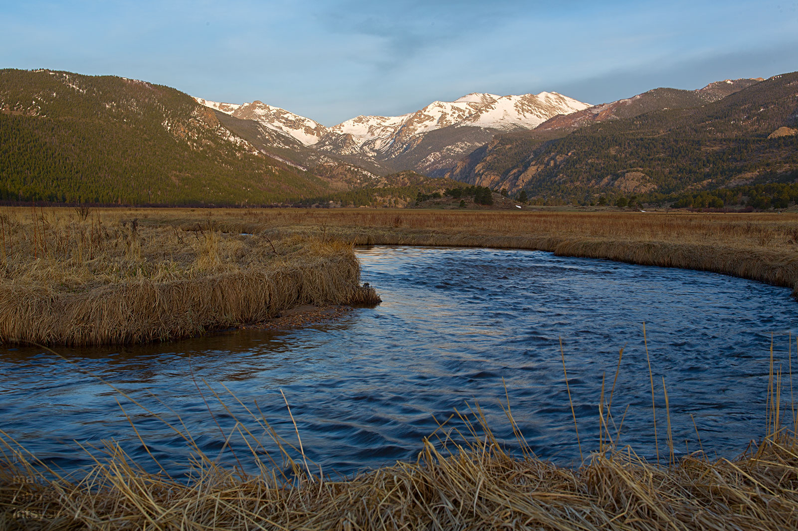 Looking west across Moraine Park, with the river flowing towards the camera.