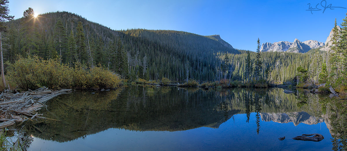 Fern Lake. Odessa Lake lies just beneath Notchtop Mountain and the Little Matterhorn, both in the distance at right.
