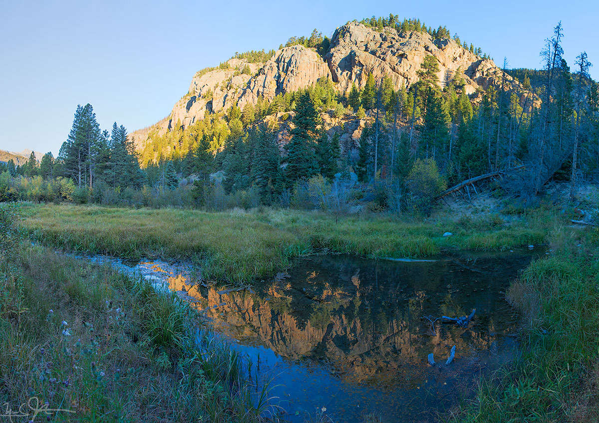 Morning sunlight on the canyon walls above the Fern Lake trail.