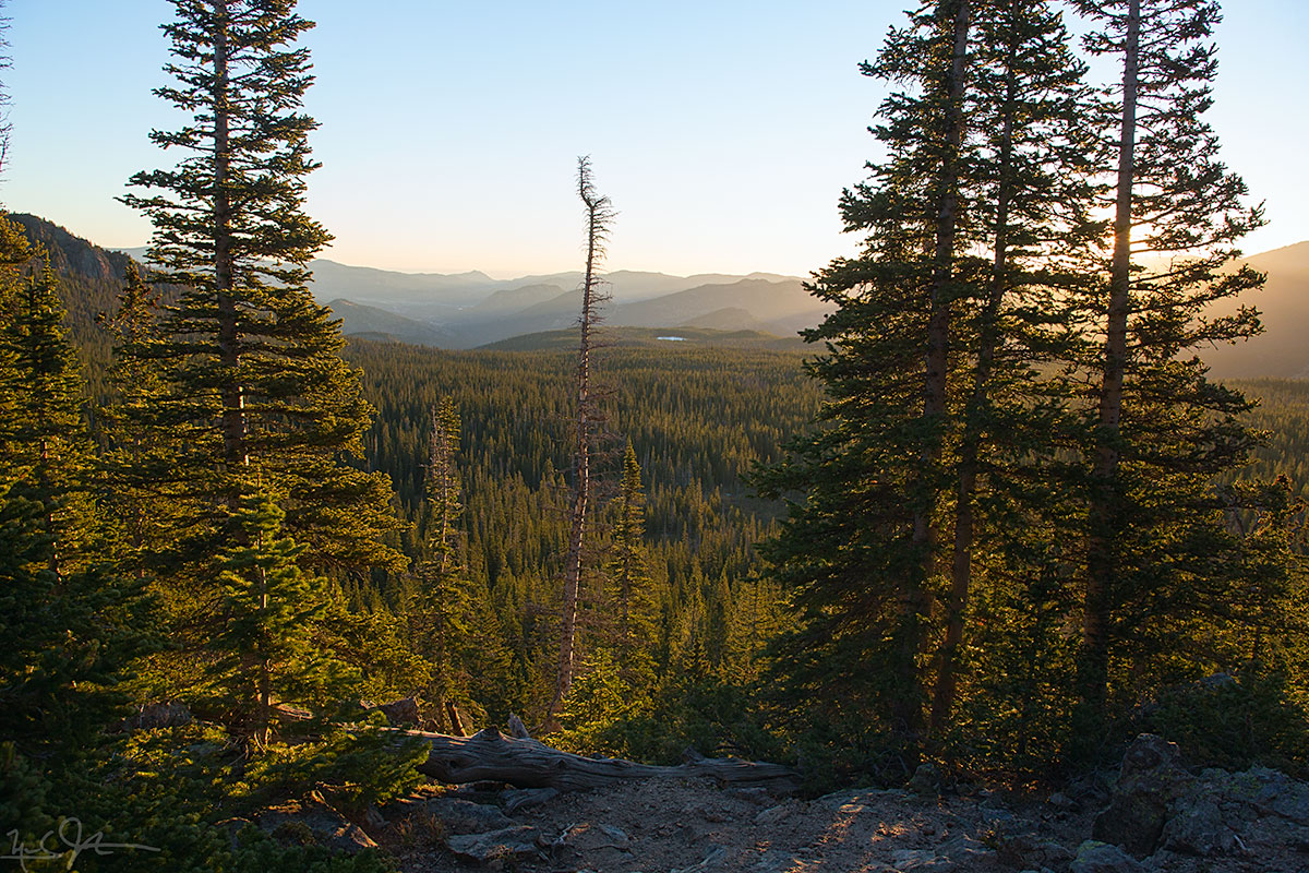 Early morning light breaks over Bierstadt Lake.