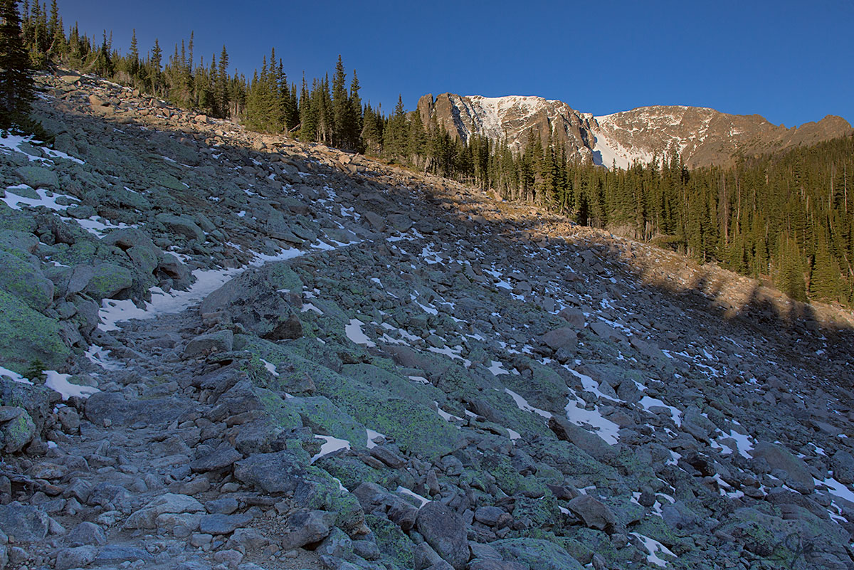 A first glimpse of Notchtop Mountain from the trail as it crosses a talus slope at around 10,500 feet.