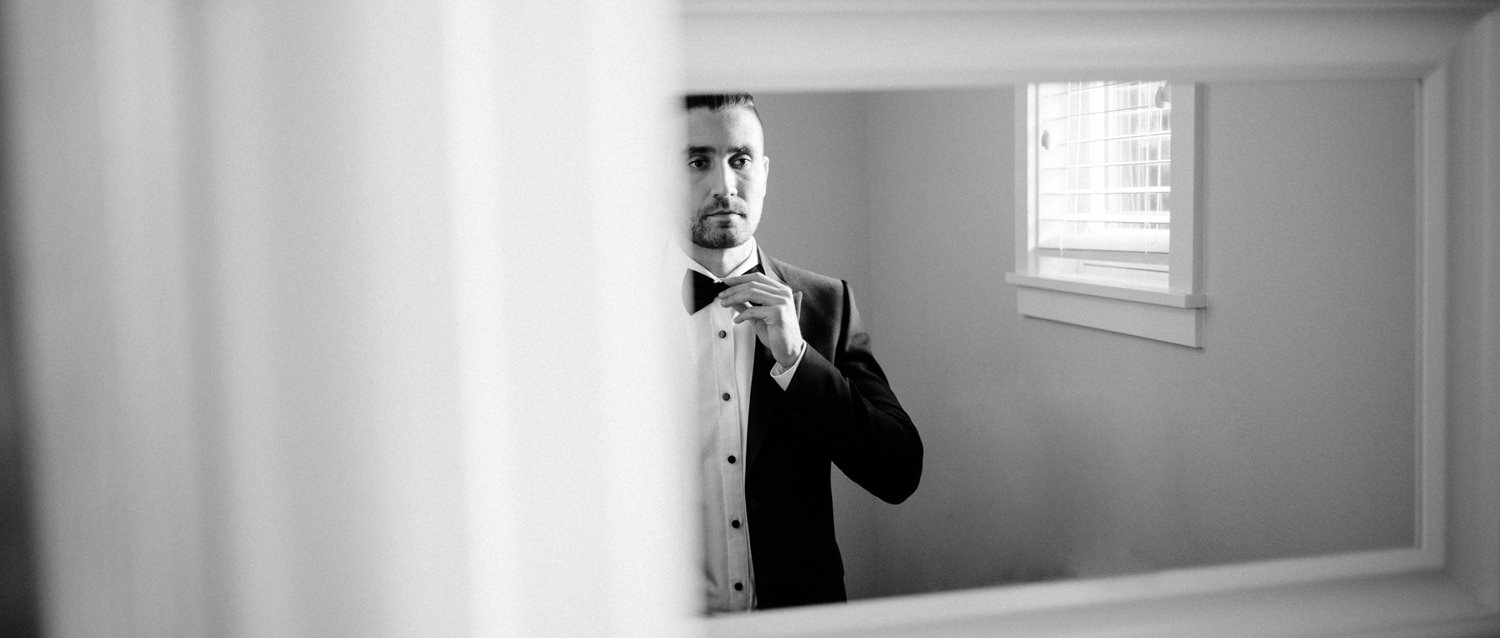 114-dapper-groom-in-tuxedo-and-bow-tie.jpg