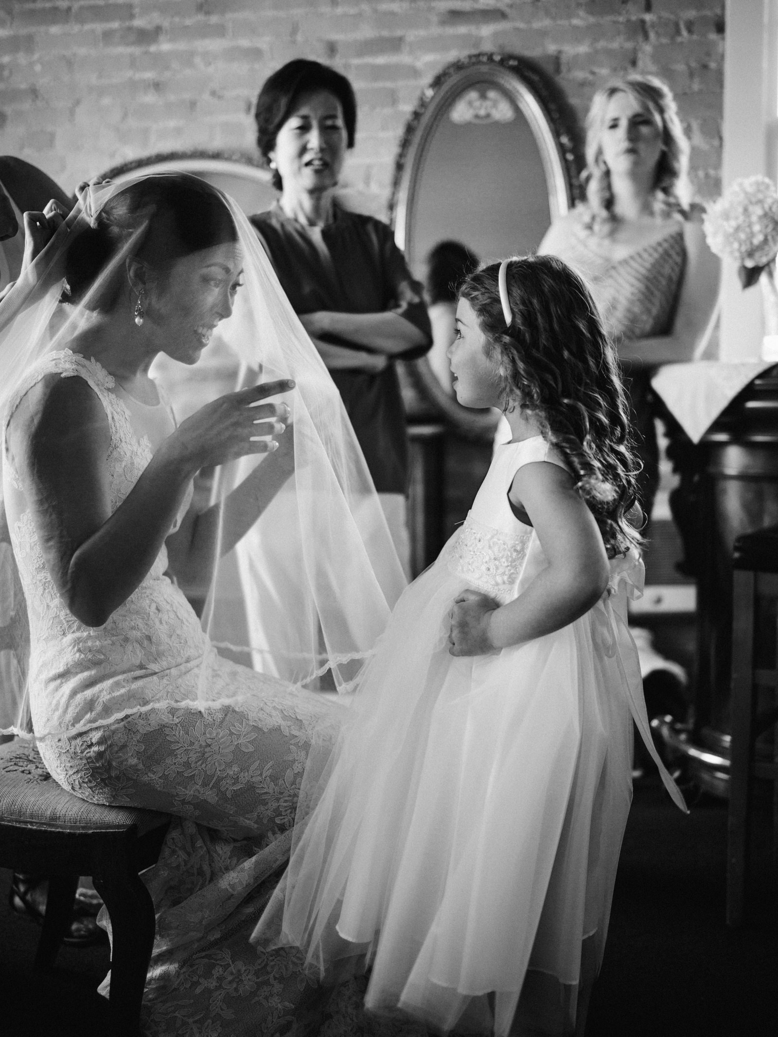 057-bride-and-flower-girl-moment-by-best-seattle-documentary-wedding-photographer-ryan-flynn.jpg