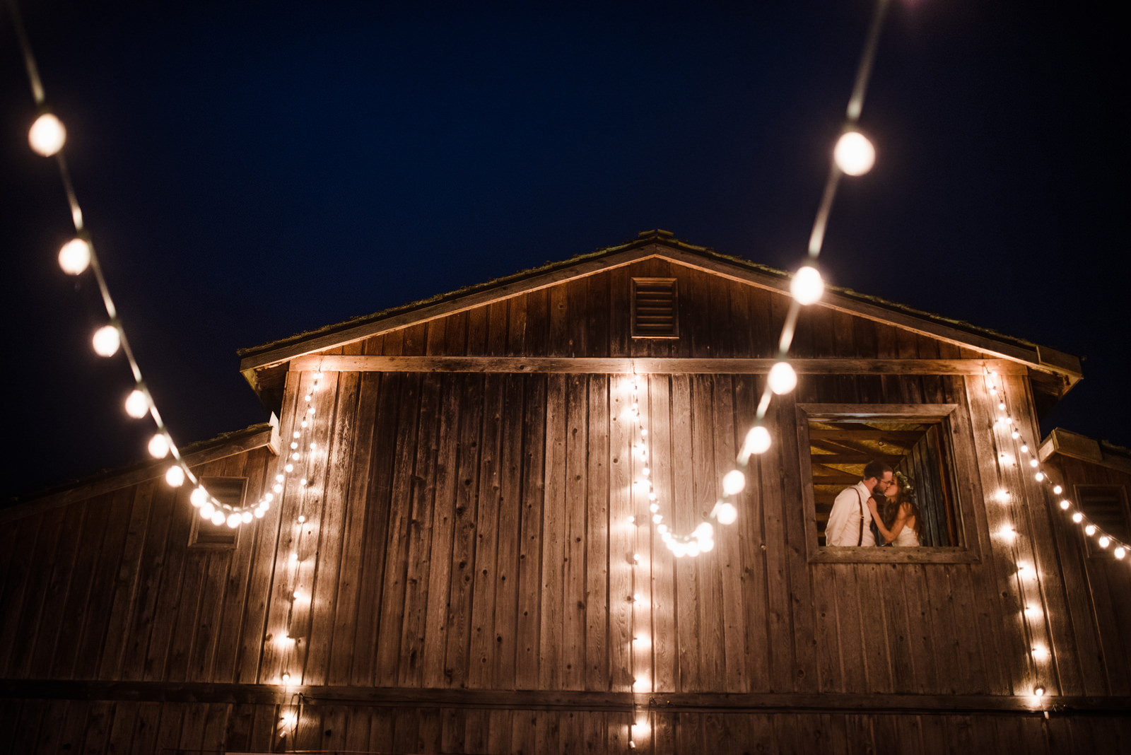 177-backyard-barn-wedding-photo-with-hanging-cafe-lights-by-ryan-flynn.jpg