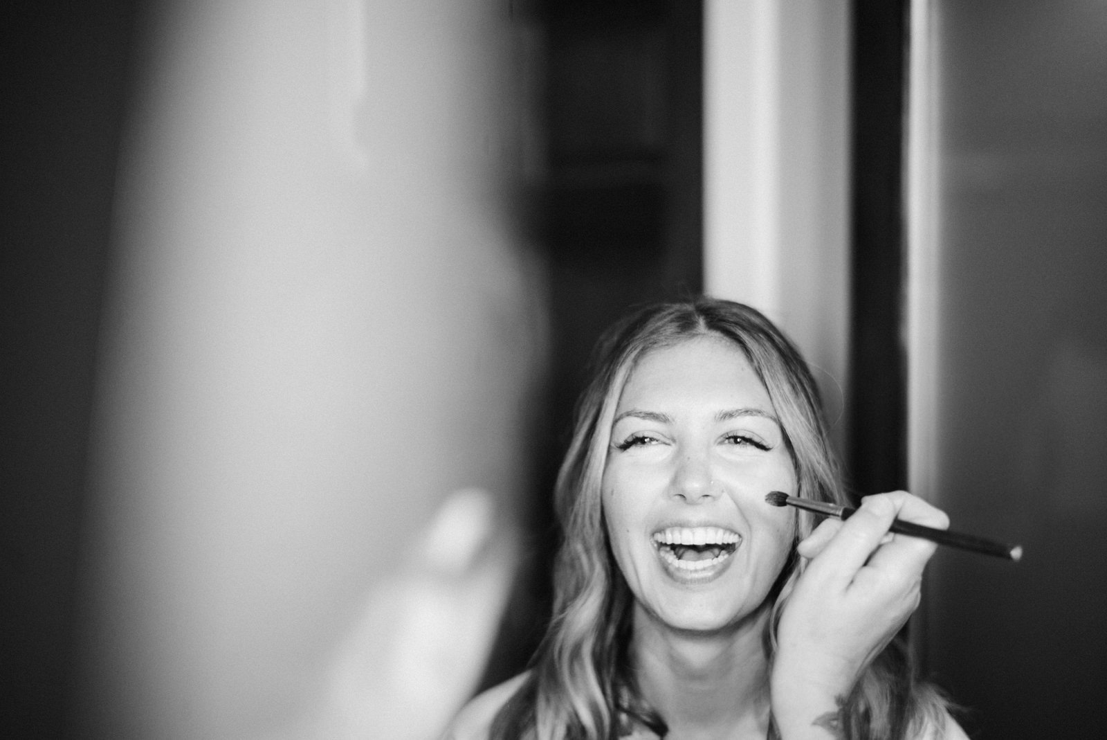 182-happy-bride-getting-ready-at-fireseed-catering-by-washington-wedding-photographer.jpg