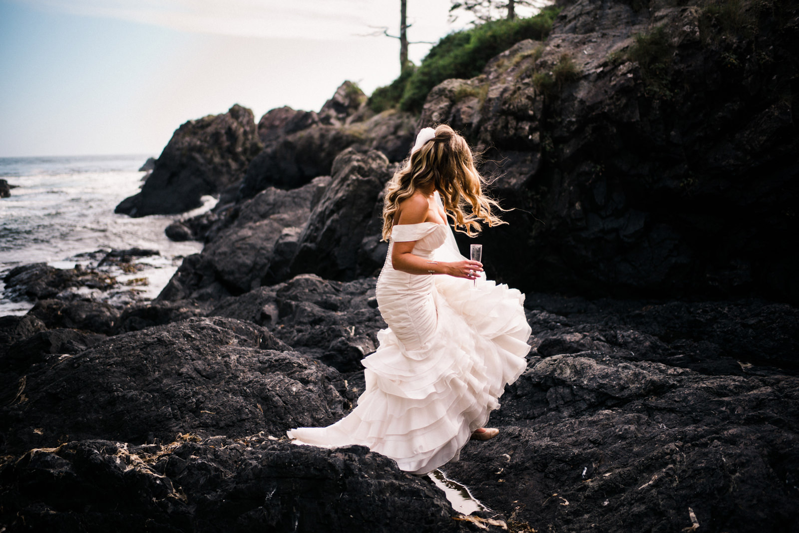 199-pnw-bride-walking-on-a-rocky-beach-by-tofino-wedding-photographer-ryan-flynn.jpg