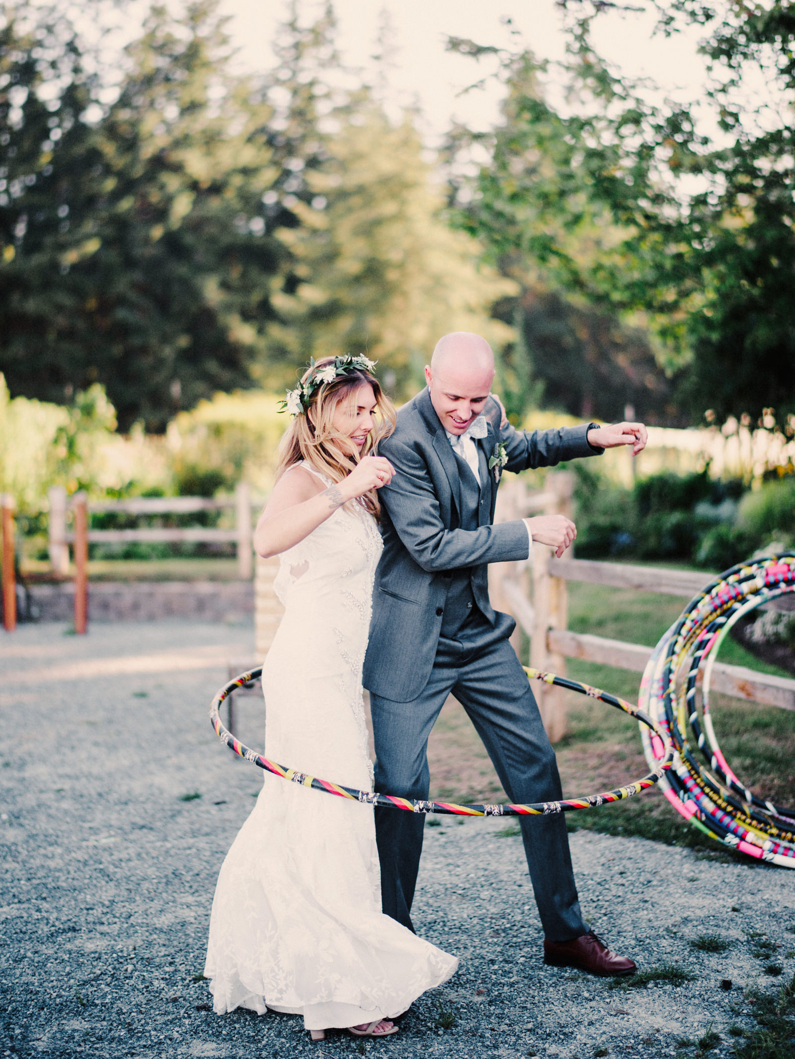 217-bride-and-groom-hula-hooping-at-fireseed-catering-by-best-seattle-film-photographer.jpg