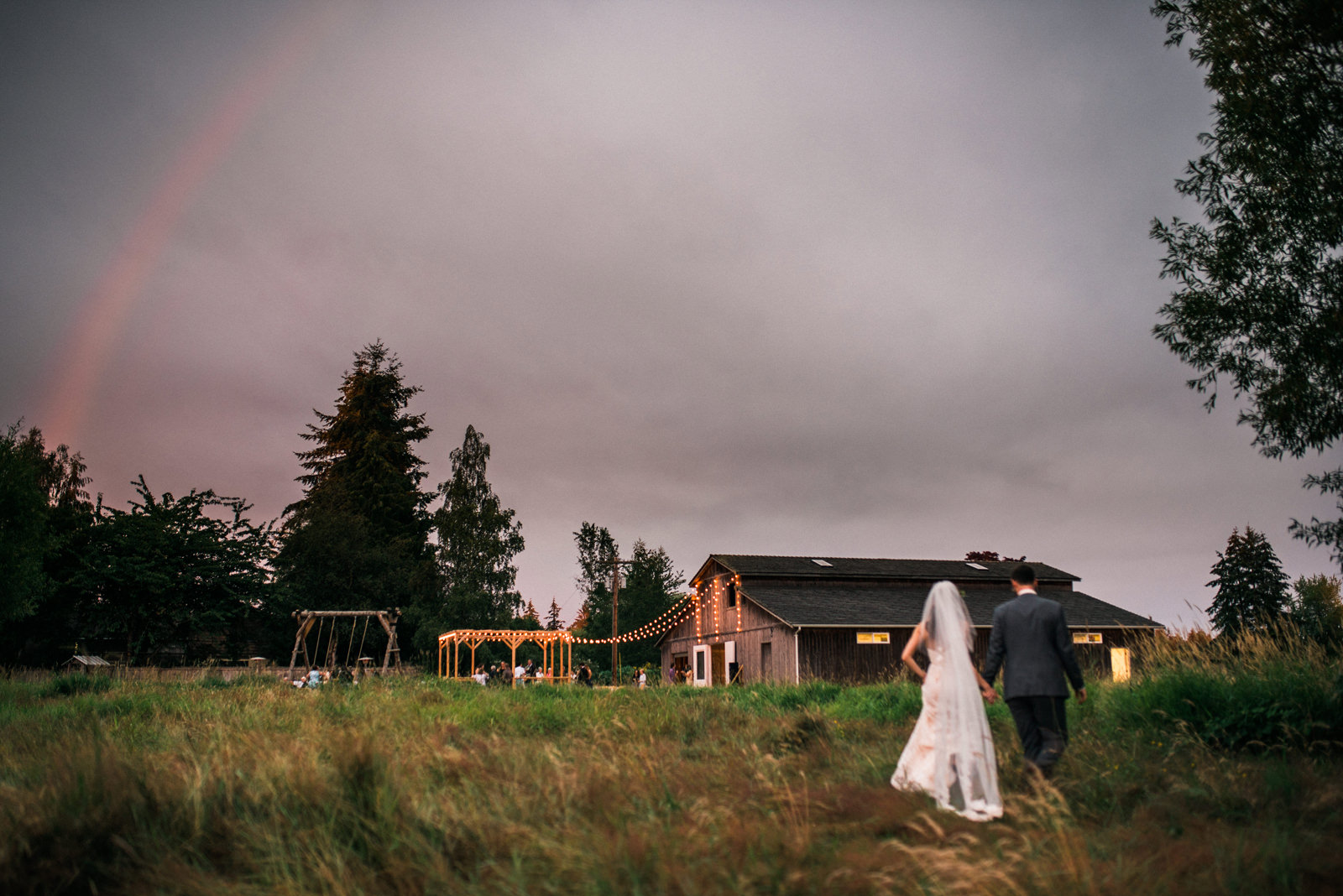 227-rainbow-over-bride-and-groom-during-a-backyard-wedding-on-camano-island.jpg