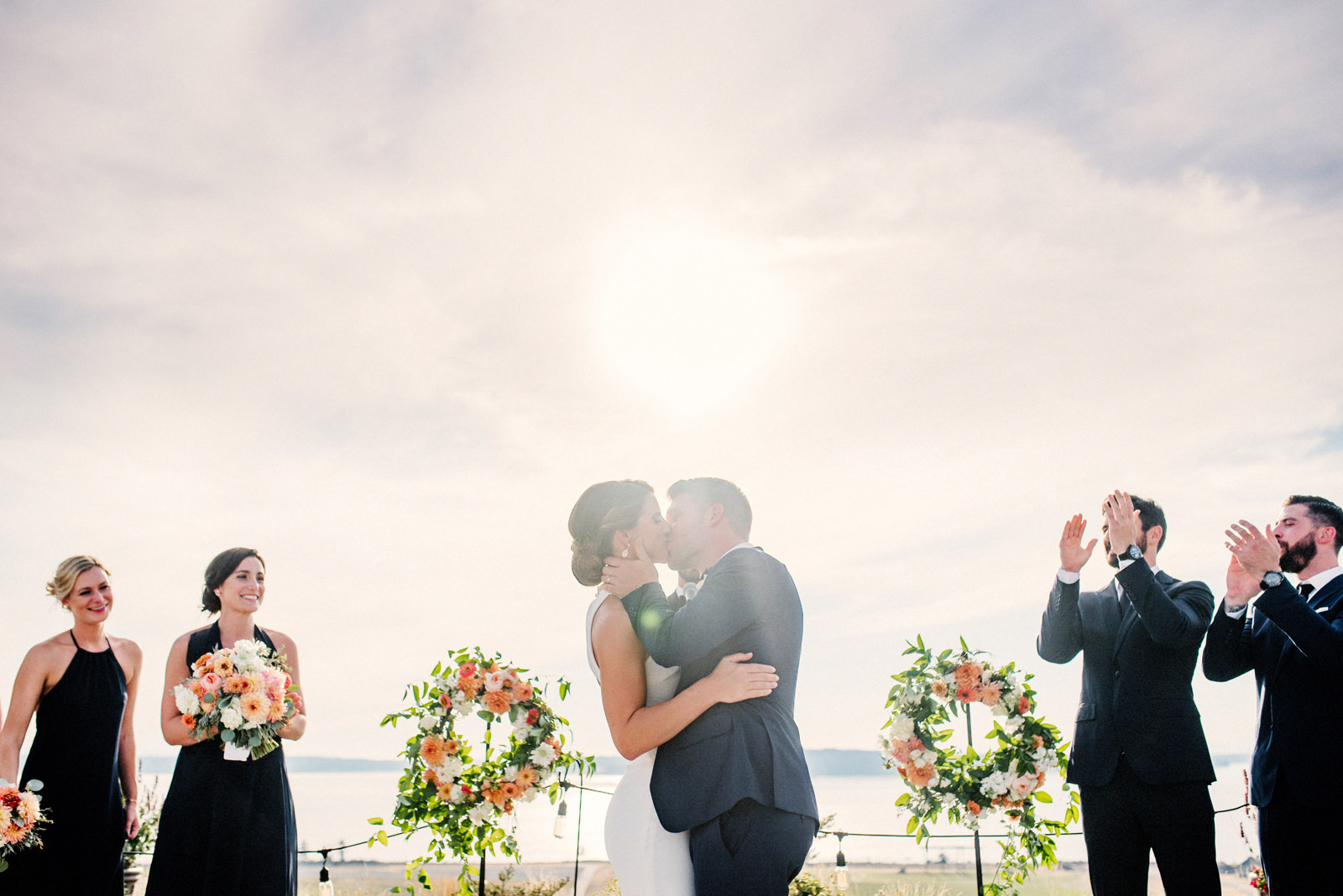 239-celebratory-bride-and-groom-kissing-during-ceremony-at-chambers-bay.jpg