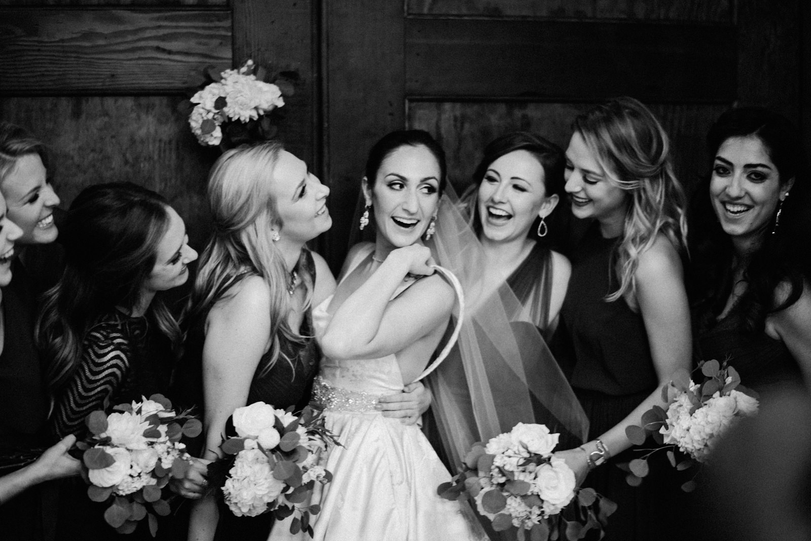 243-bride-and-bridesmaids-laughing-at-sodo-park-by-best-seattle-film-photographer-ryan-flynn.jpg