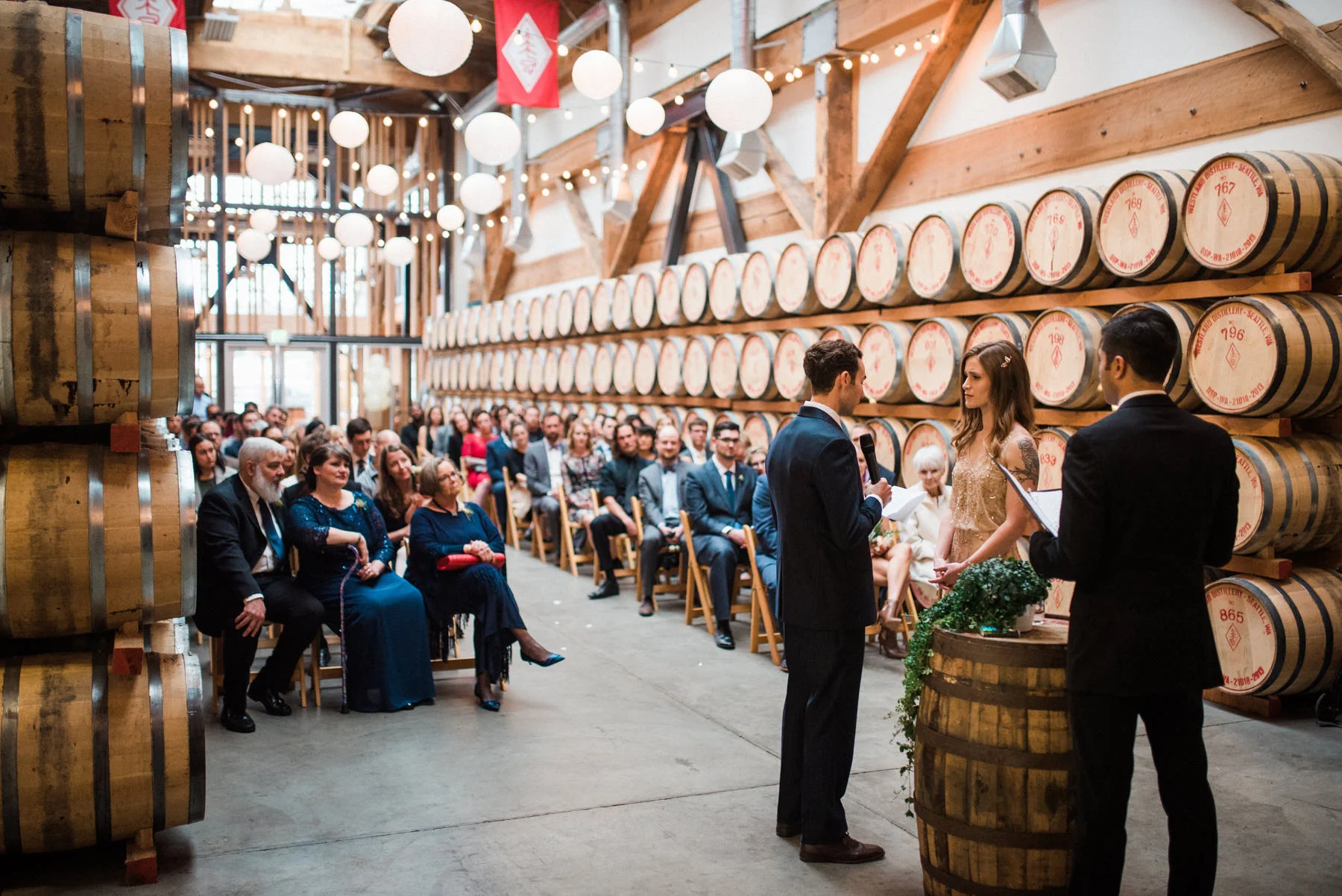 037-wedding-ceremony-among-whiskey-barrels-at-westland-distillery.jpg