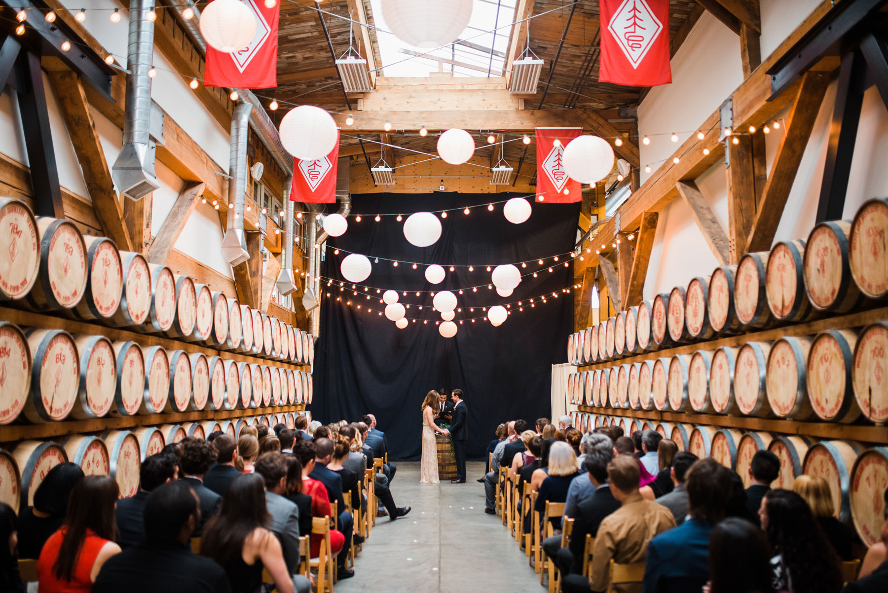 038-wedding-ceremony-among-whiskey-barrels-at-westland-distillery-in-seattle.jpg