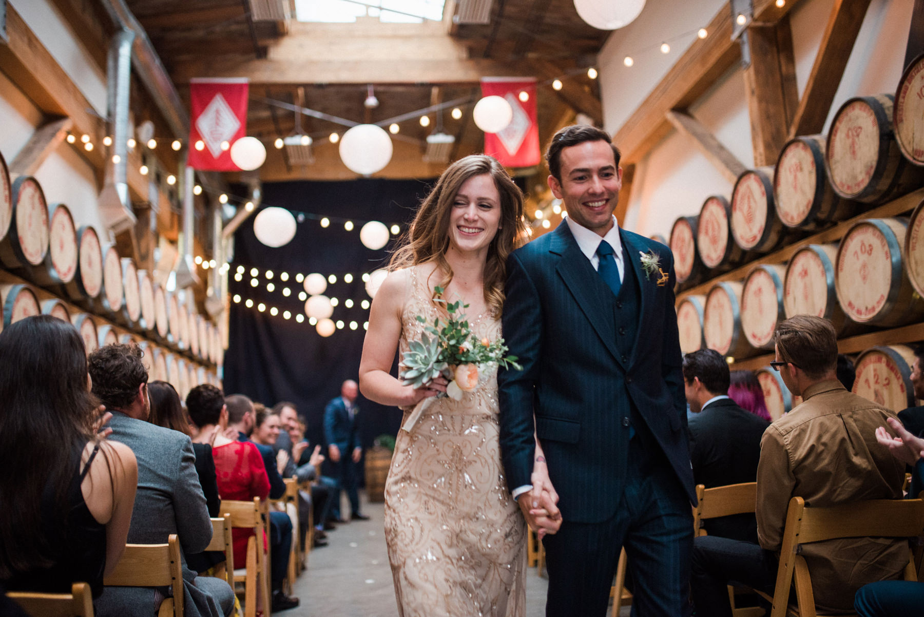 045-wedding-ceremony-among-whiskey-barrels-at-westland-distillery-in-seattle.jpg