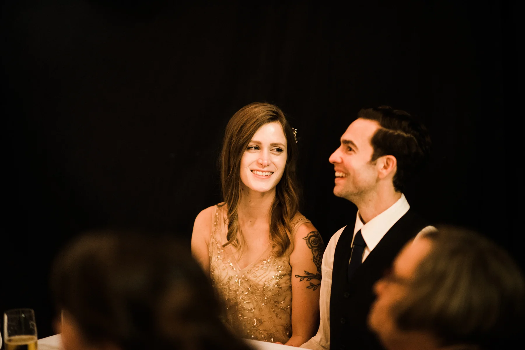 069-long-table-wedding-dinner-under-string-lights-at-westland-distillery.jpg