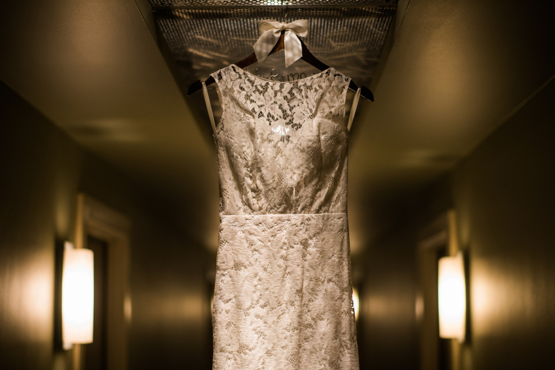 160-sarah-seven-dress-hanging-in-a-hotel.jpg