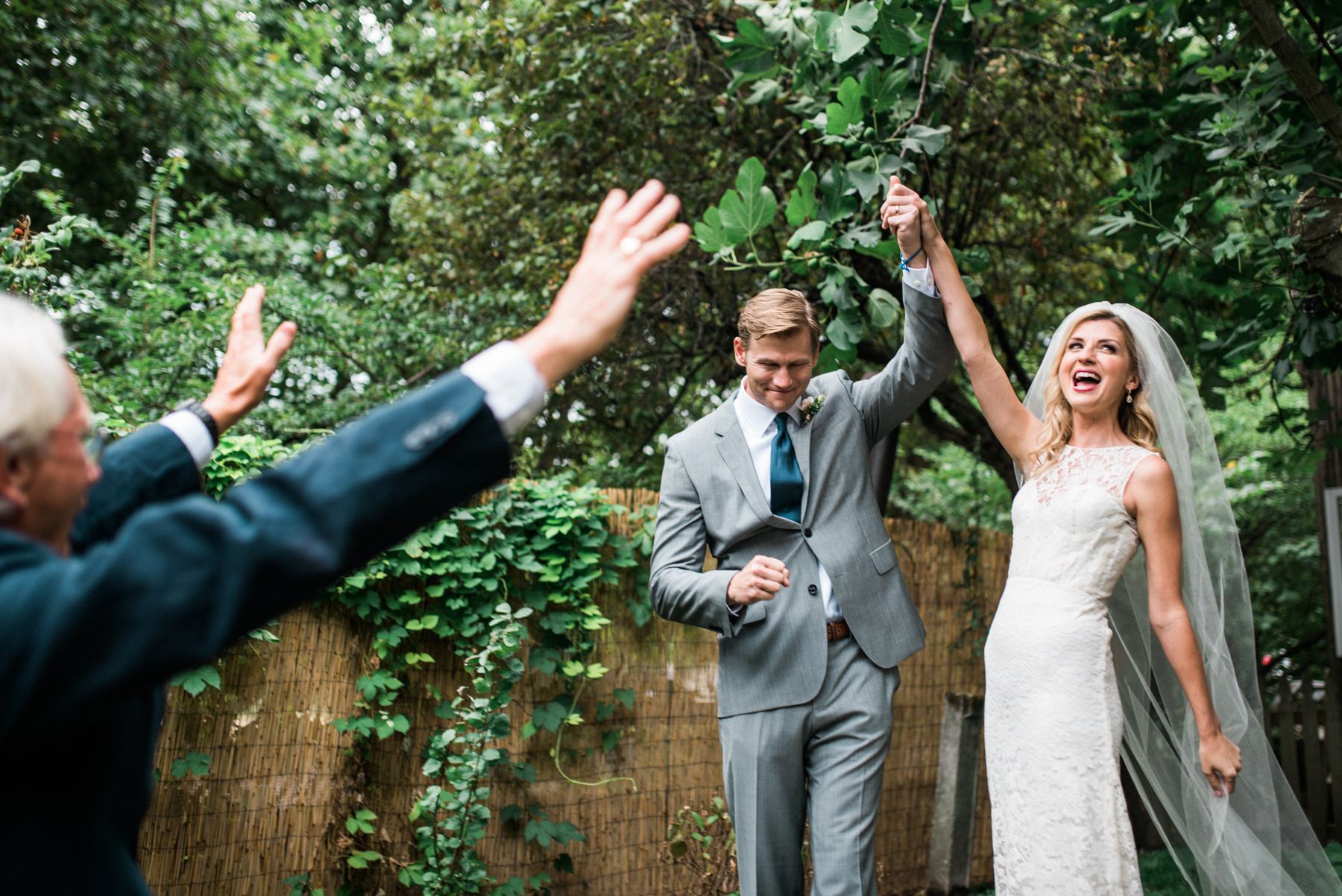 218-excited-couple-cheering-after-their-first-kiss-by-documentary-seattle-wedding-photographer.jpg