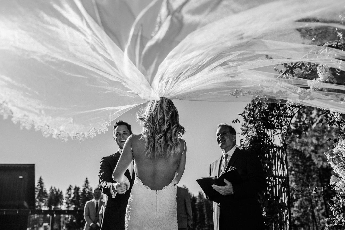 007-funny-moment-of-a-brides-veil-blowing-in-the-wind-at-swiftwater-cellars.jpg