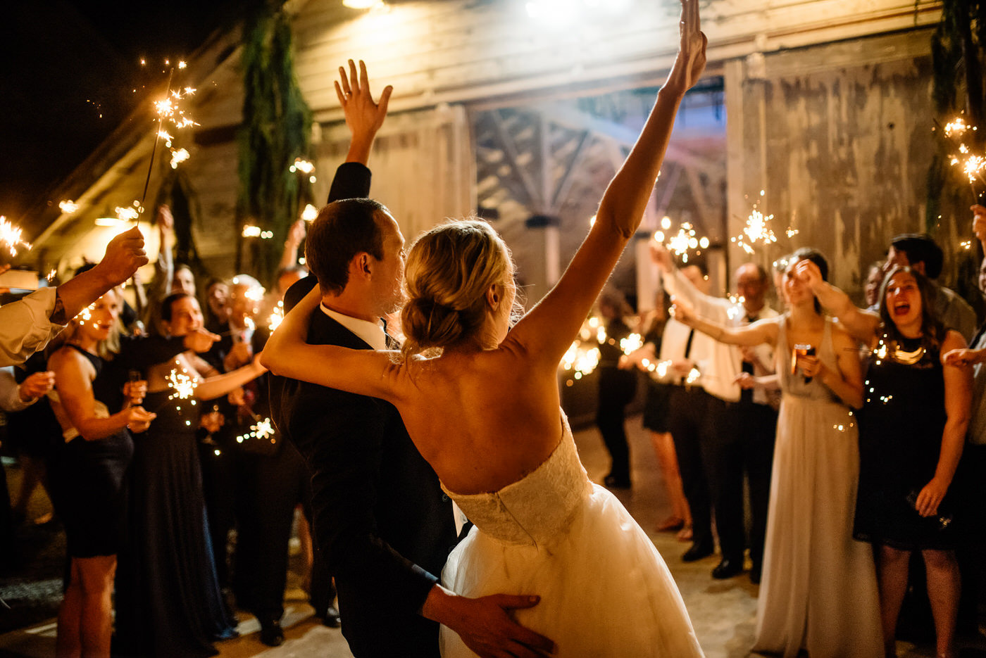 009-joyful-bride-and-groom-during-a-sparkler-exit-at-dairyland.jpg