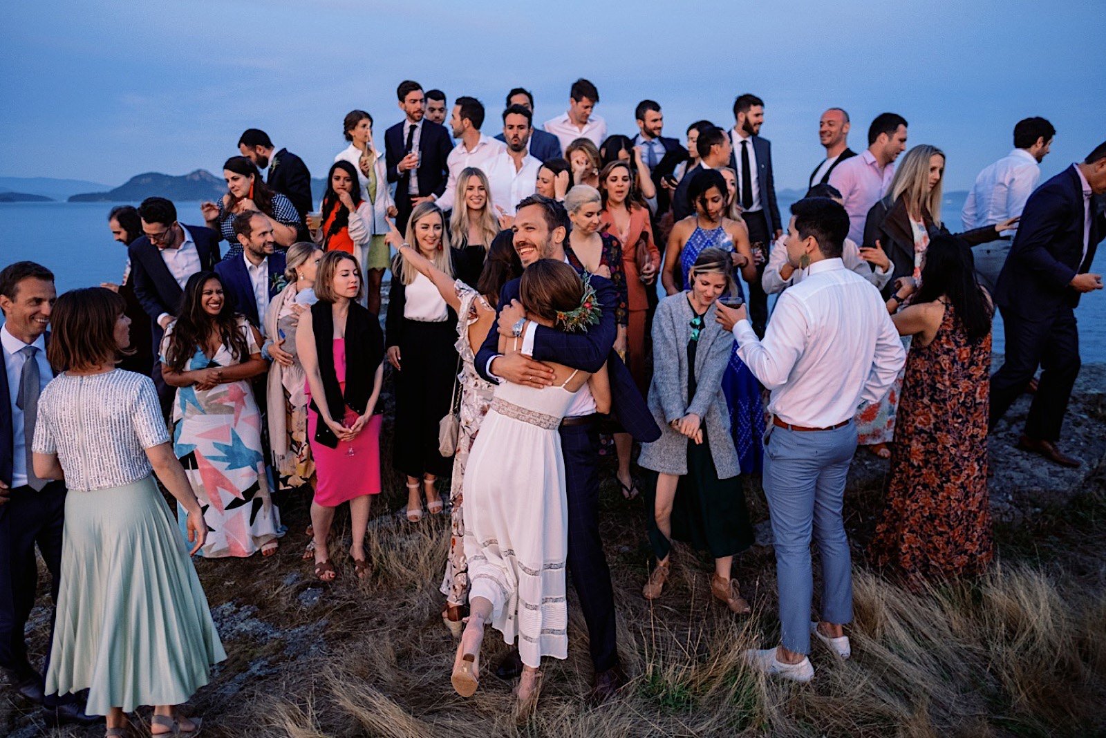 88_guests_sunset_Views_from_Island_Wedding_With_the_enjoying_Outdoor_Orcas.jpg