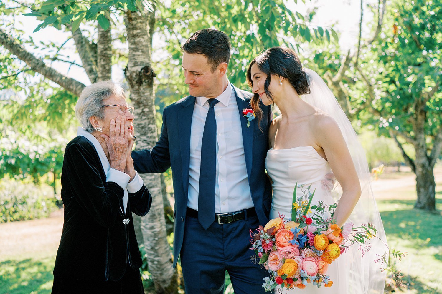 002_Bride and groom having a sweet family moment with their grandmother, by Seattle documentary wedding photographer.jpg