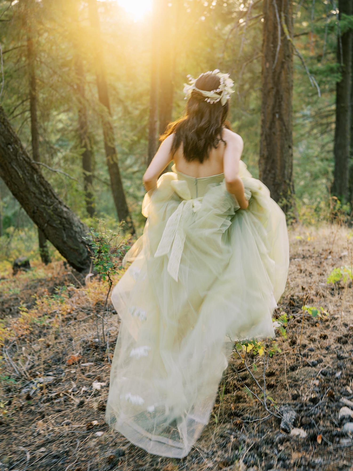 012_A bride running through a sunset forest in a green dress, in Leavenworth, Washington.jpg