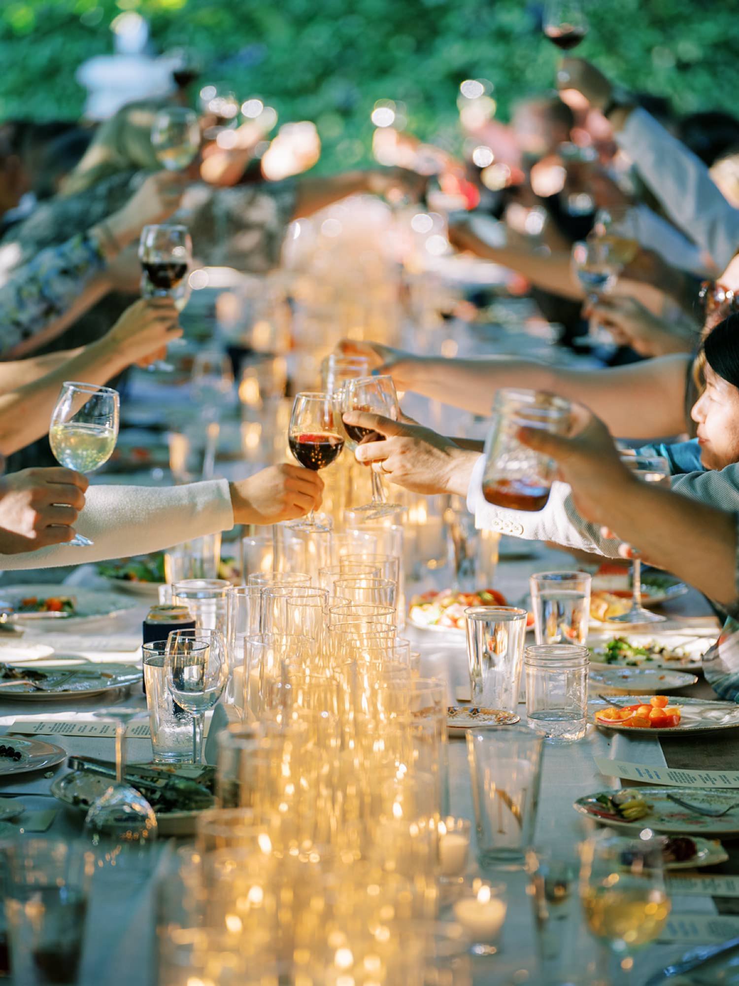 031_Long dinner table with a lot of candles at a wedding at the Wayfarer on Whidbey Island by Ryan Flynn Photography, with Harry’s Fine Foods.jpg