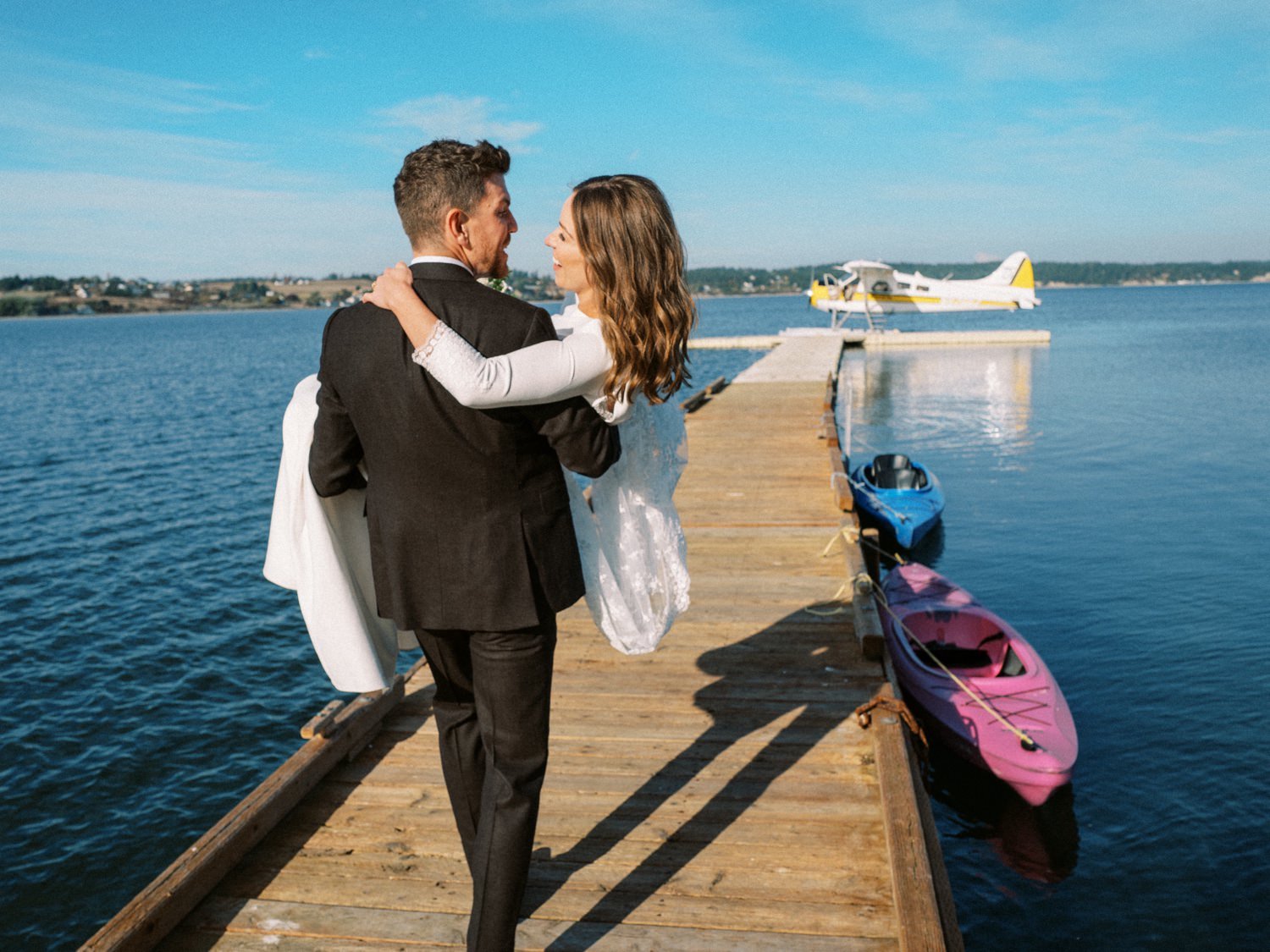 082_A bride and groom arrive to their wedding by Seaplane from Kenmore Air, at the Captain Whidbey inn.jpg
